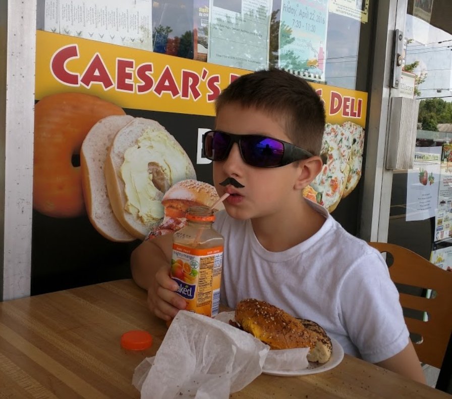 Look at this dapper young lad coolin it at Caesar's Bagels in Hamilton. This place is nothing but good vibes! 😎😋
