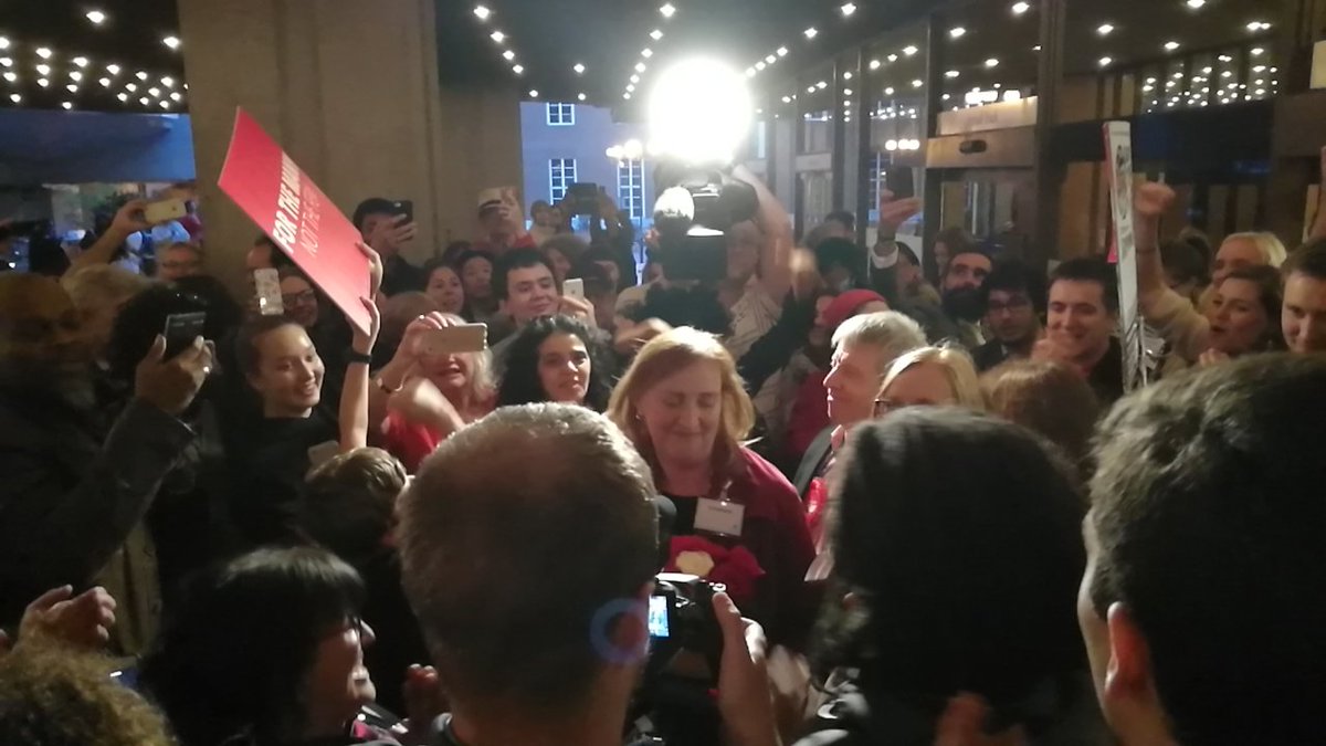 CGreggor's tweet photo. Jubilant crowd surround Emma Dent Coad after long awaited result #GE2017 #SWLGE2017 @SW_Londoner https://t.co/aLUkAMIFFY