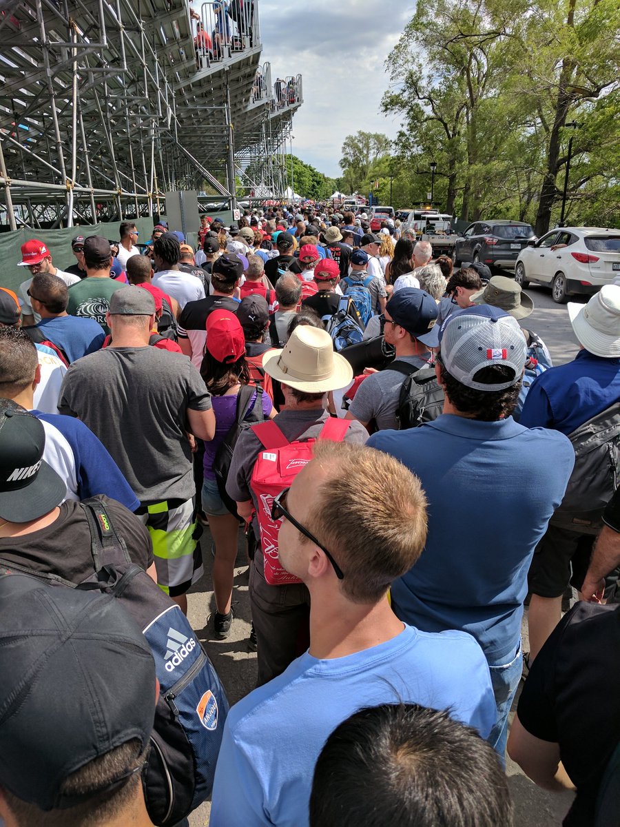 CrapSelfie's tweet photo. @Formula1Canada it appears we are trapped on the way out too. Crowd just busted through the barrier and is walking down the road to exit. https://t.co/4oLma2TkGy