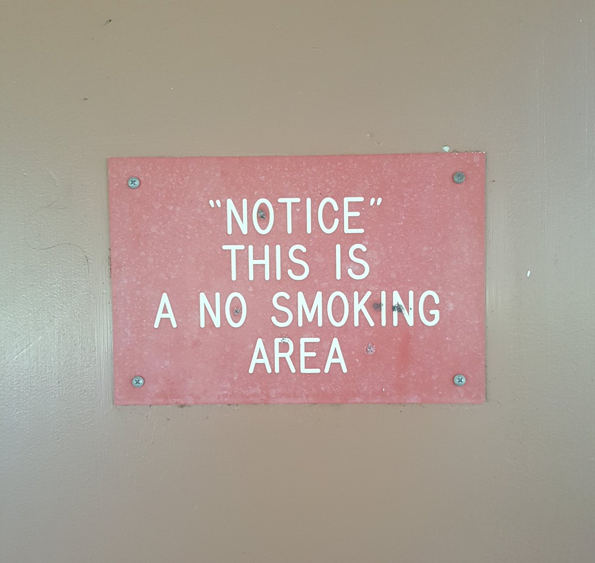 a sign that reads, "NOTICE" THIS IS A NO SMOKING AREA