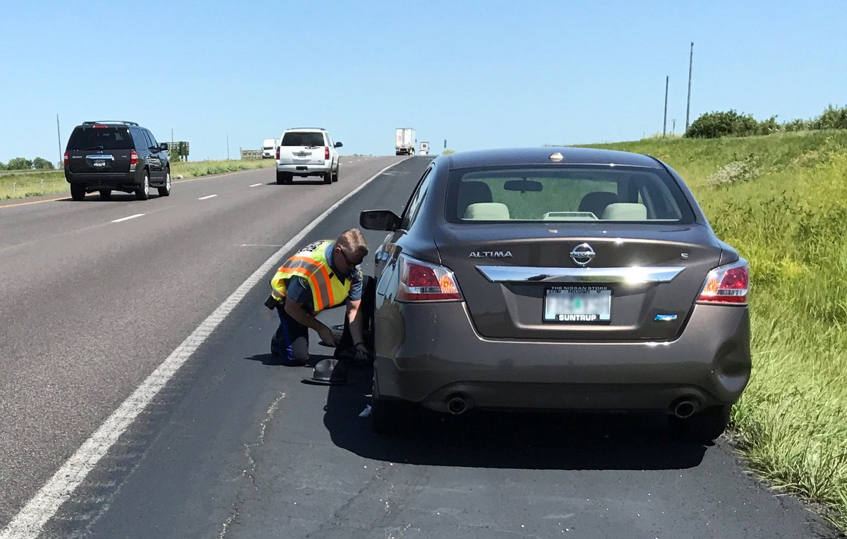Lt. Colonel Olson and I stopped for three stranded motorists today.  This one was in Callaway County. Hot temperatures create tire issues.
