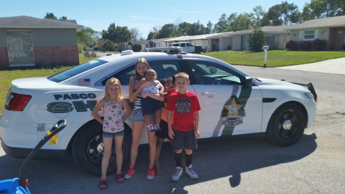 PascoSheriff's tweet photo. Catch one, catch them all! Some neighborhood kids Chase down Deputy Oeckham for Pokémon cards! https://t.co/hPwLjs48ML