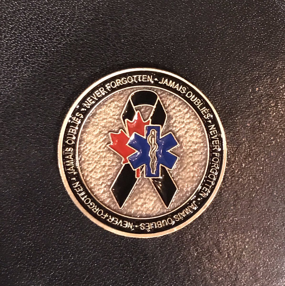 ToddDohertyMP's tweet photo. Honoured to receive this challenge coin from my colleague @TJHarveyLib &amp; @PAC_Paramedic #thankyou #C211 #PTSDFramework #paramedics https://t.co/0YE7MQSEpp