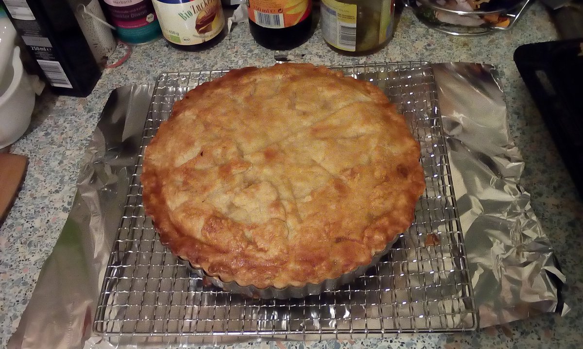 an apple pie on a cooling rack