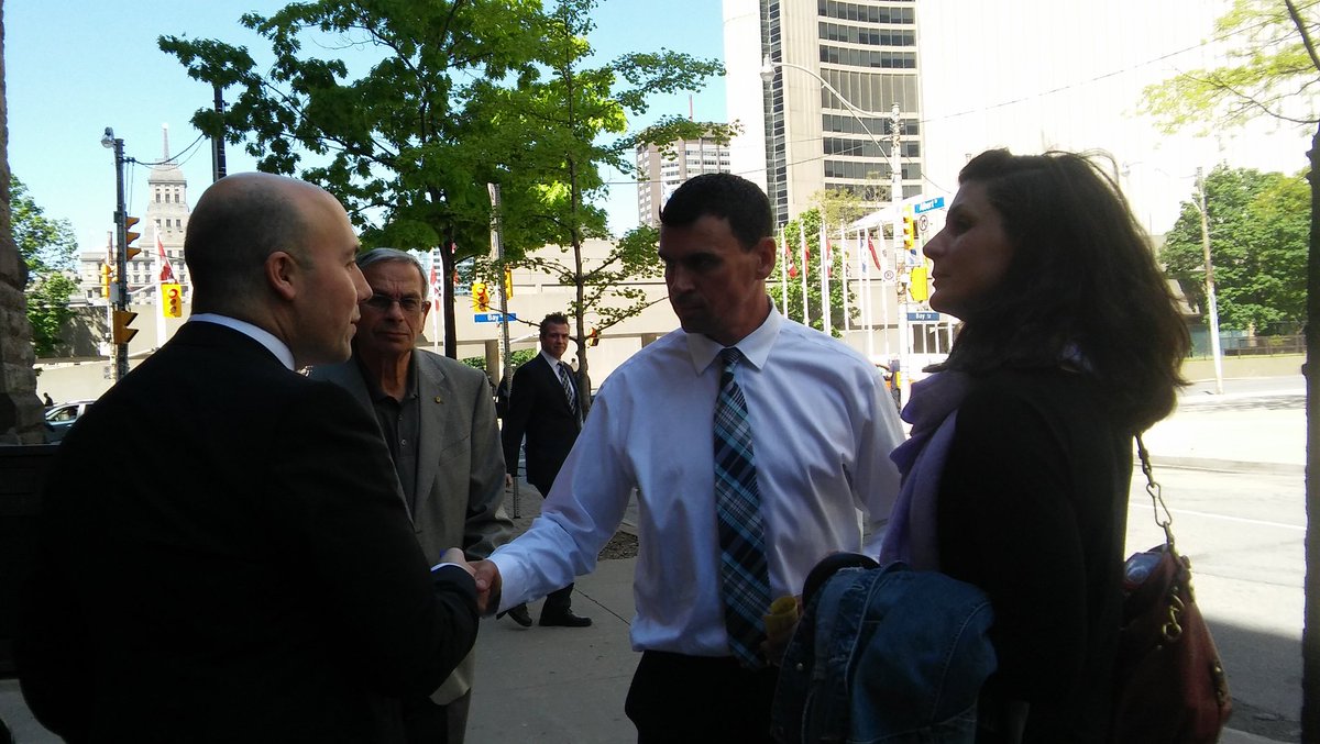 xjackiehong's tweet photo. Ken Pagan shakes hands with his lawyer Tyler Smith as he leaves Old City Hall after pleading guilty. Both declined comment. https://t.co/wMhDSz4lxN