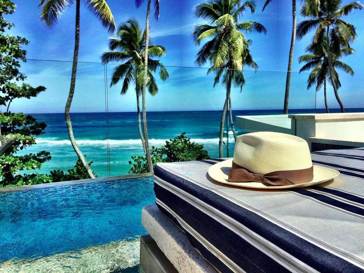 RitzCarlton's tweet photo. Begin your #SummerGetaway lounging by your own private rooftop #pool at our East Beach suites. #CaribbeanView https://t.co/sgMJgzCXIE