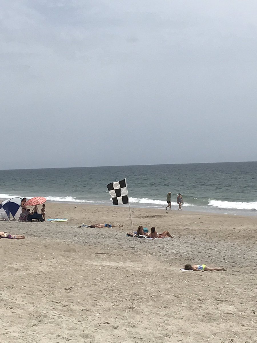 CathKingston's tweet photo. Even the Checkered Flag is down here at the beach! Post-#CocaCola600 #10DaysOfThunder recovery! @WrightsvilleNC https://t.co/vWea48lCeN