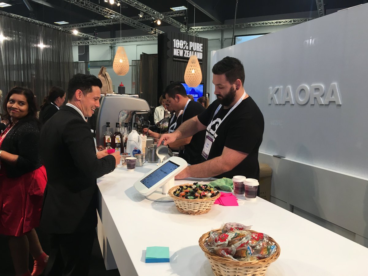 TweetBEIA's tweet photo. @FlyAirNZ are smashing out the coffees this morning over at their stand. If you're lucky you might get a lolly and cookie too 😏 ☕️🍭🍪 #CINZ17 https://t.co/kH5pZtQ6ai