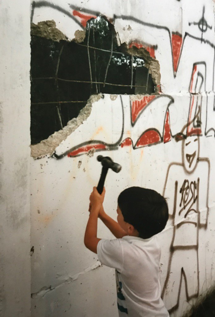 DickieDover's tweet photo. A young Ryan Dover demolishing a section of the #berlinwall 1990 https://t.co/lZBXwbKaJe