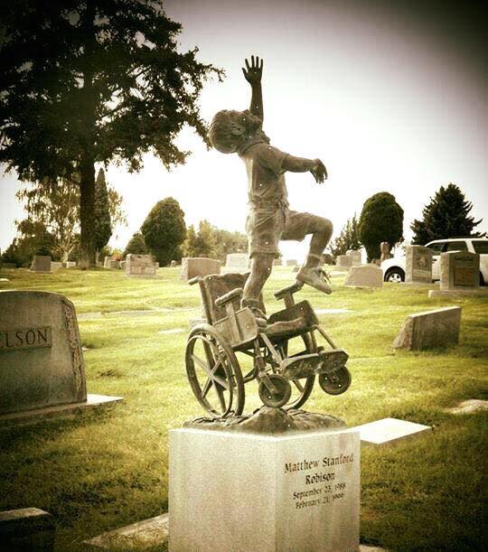 A Dad from Salt Lake City,Utah, designed this beautiful headstone for his wheelchair-bound son, depicting him 'free of his earthly burdens.'