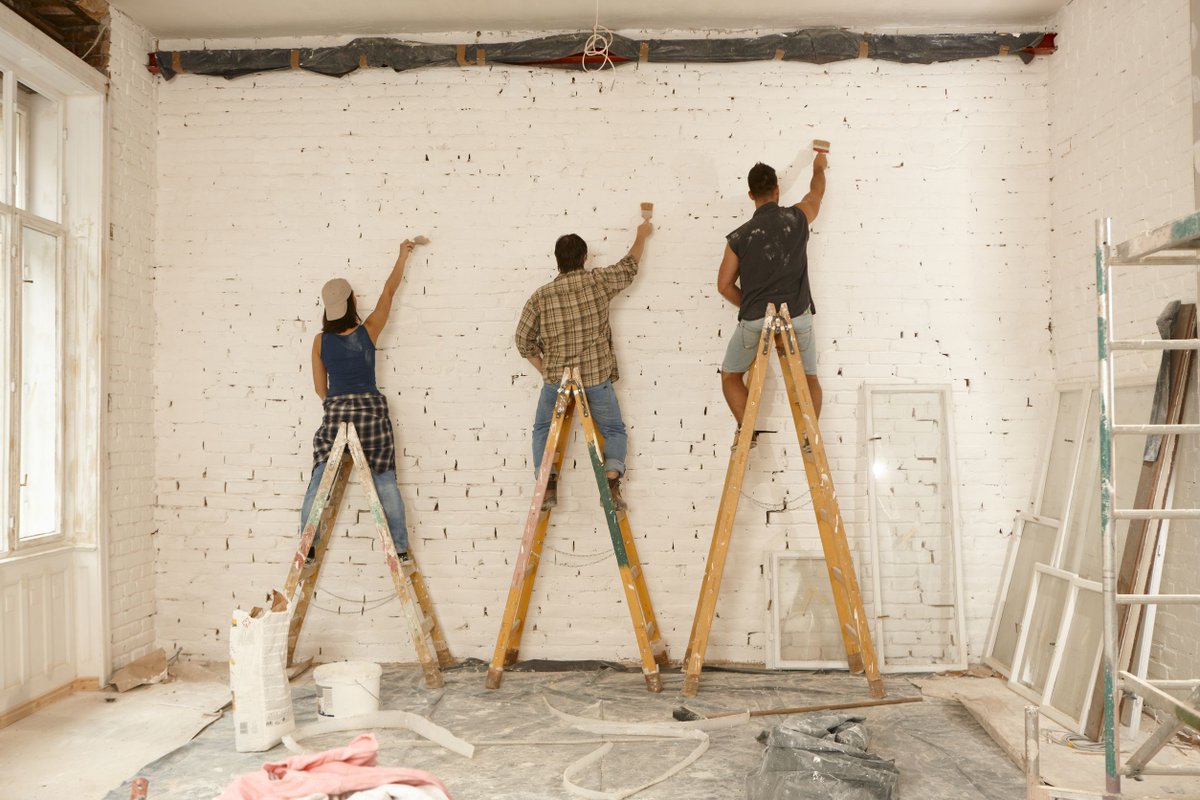 #TheThreeMusketeers Our painter team working on renovation site, standing on ladder, painting wall by brush.
