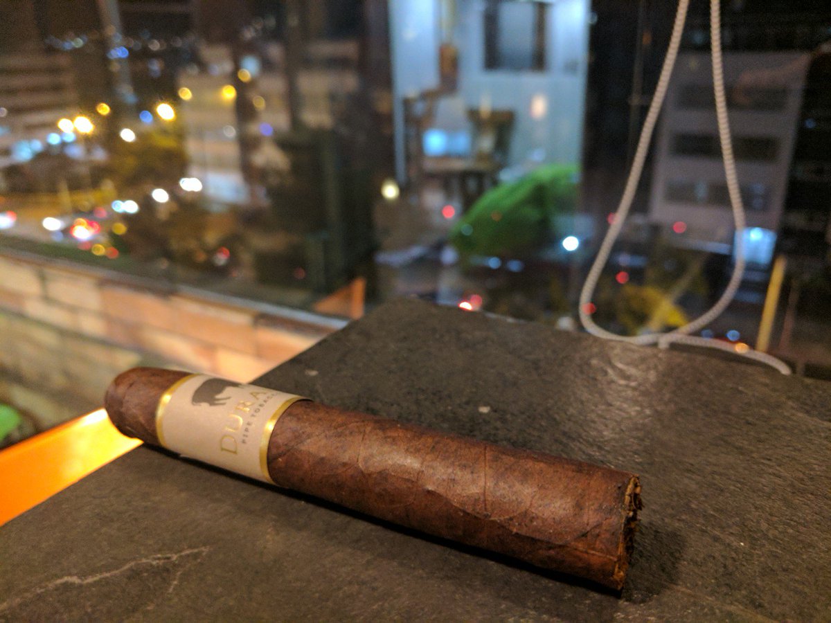 AspiringGent's tweet photo. Preparing the smoke the peach blend @durangocigars with a fine view https://t.co/Ckt6Dswus4 #Cigar #cigarsafari https://t.co/rPD0YJAz70
