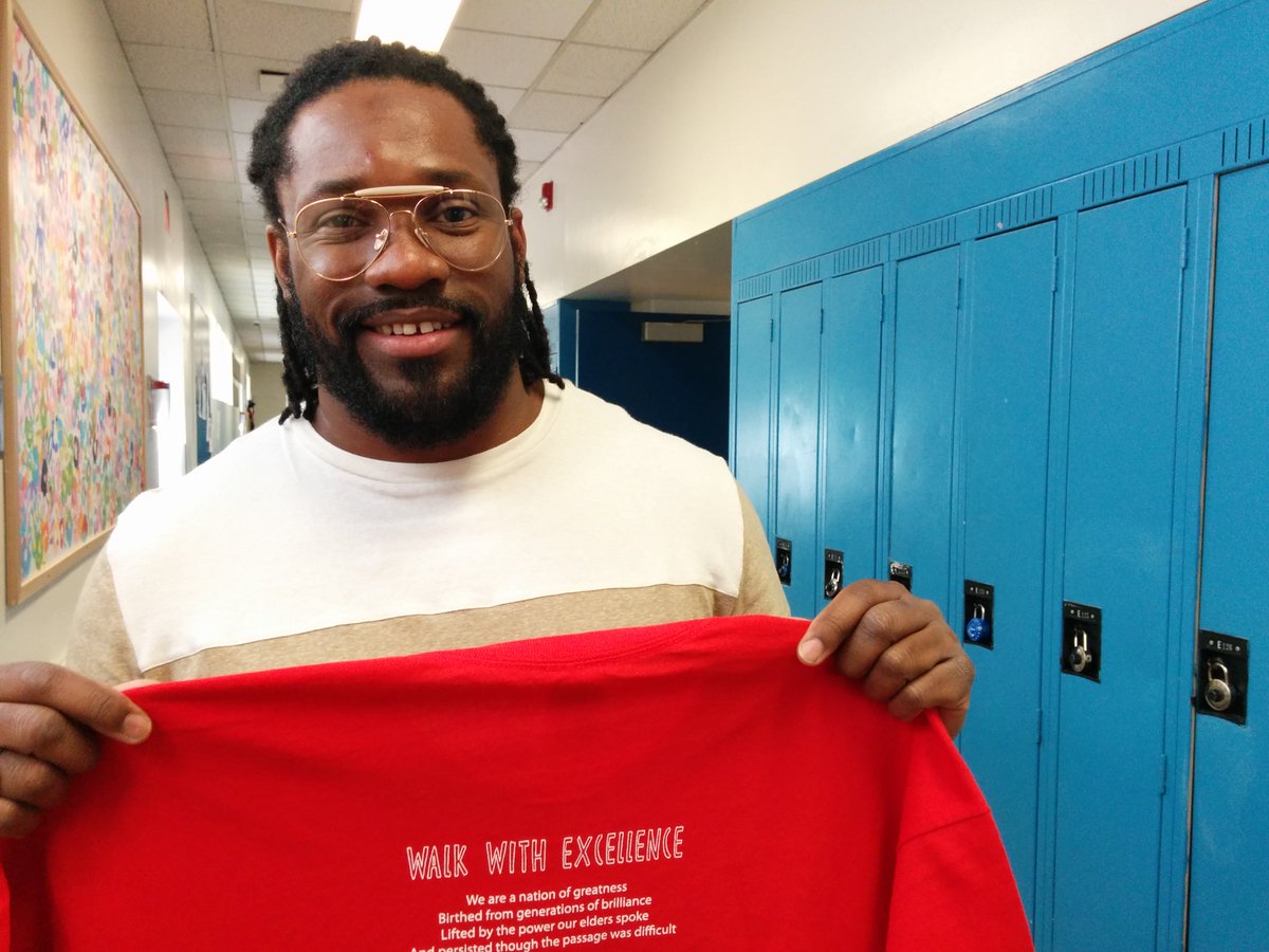 Jamaal Jackson Rogers is Ott's poet laureate &amp; a former student of Coddett's. He wrote the poem on the t-shirt, ending: "the world is yours"