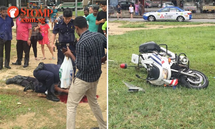 stompsingapore's tweet photo. TP officer lies in pool of blood at Serangoon field after alleged accident https://t.co/Q1JXAIMSa0 https://t.co/ysANPvAmhL