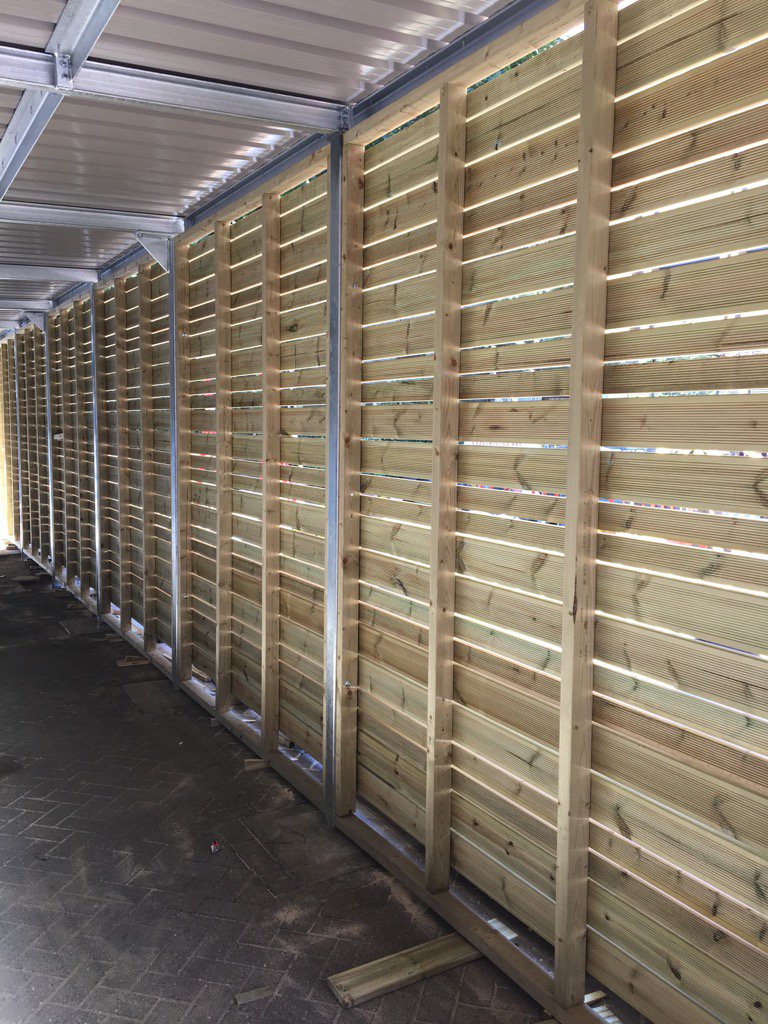 Collfin's tweet image. RBS Islington Landscaping Scheme - view of Timber Screen from within Bike Shelter