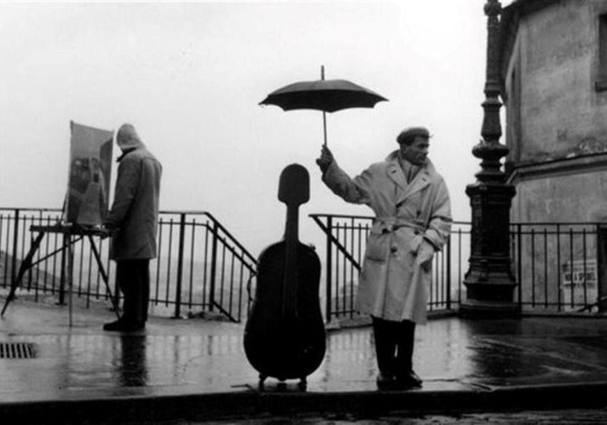 Robert Doisneau #photography 
A Musician In The Rain, 1957