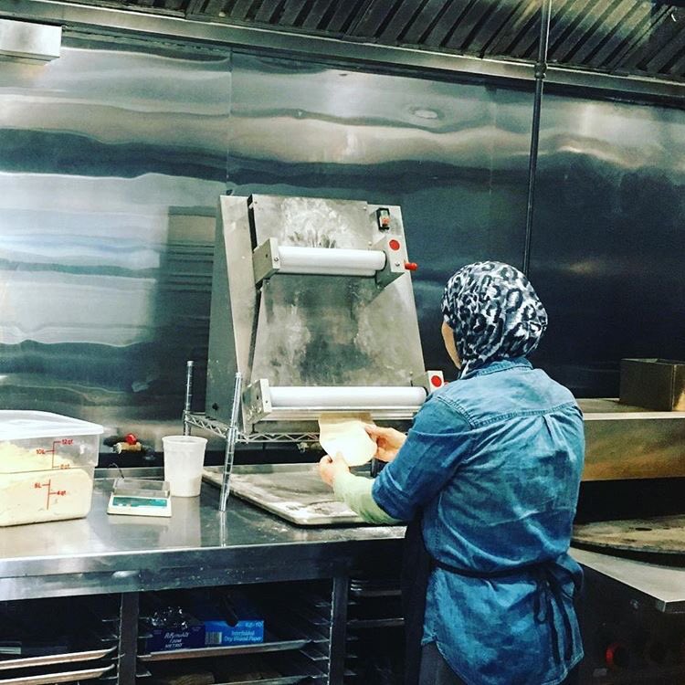 TaheniMG's tweet photo. Our beloved mama makes all of the bread throughout the day. Our bread is freshly made for your order. #tahenimg #bread #pita #sajbread #saj https://t.co/Dootozz3Us