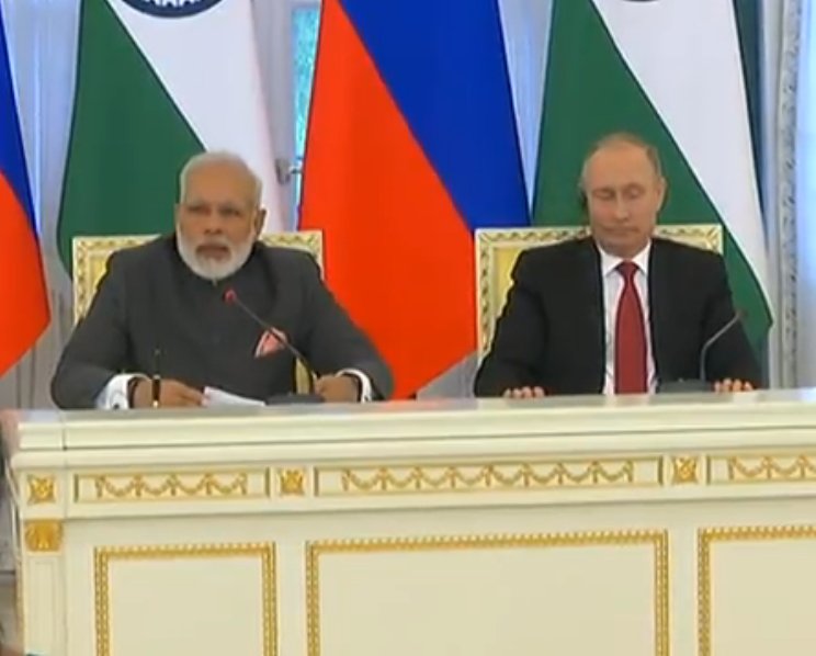 BJP4India's tweet photo. PM Shri @narendramodi is addressing the joint press statement in St.Petersburg, Russia. LIVE at https://t.co/jtwD1yPhm4 #ModiInRussia https://t.co/Php0ZlL6Zs