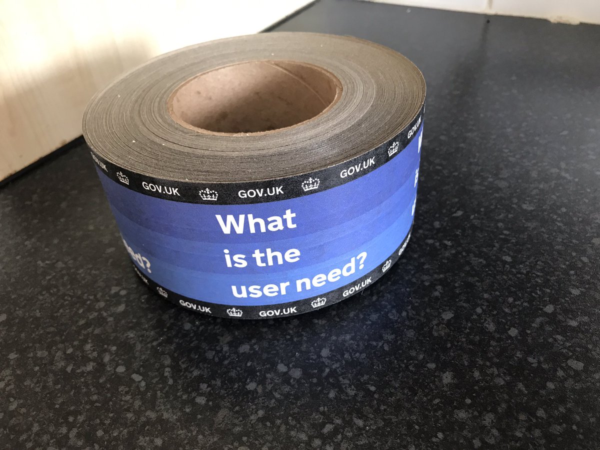 A roll of tape, with 'what is the user need?' printed on it