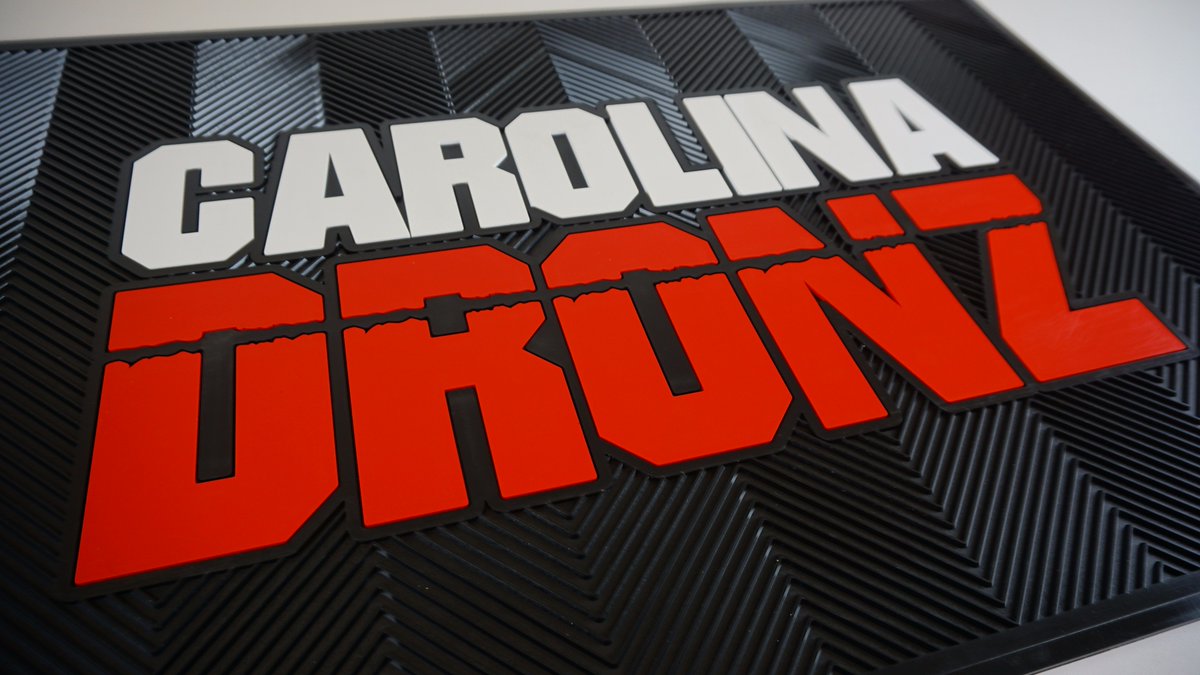 Polyenterprises's tweet photo. This floor mat for #carolinadronz stands out well with the white and red against a black background. #custommolded #custommats #poly https://t.co/yXpHBUrTSG