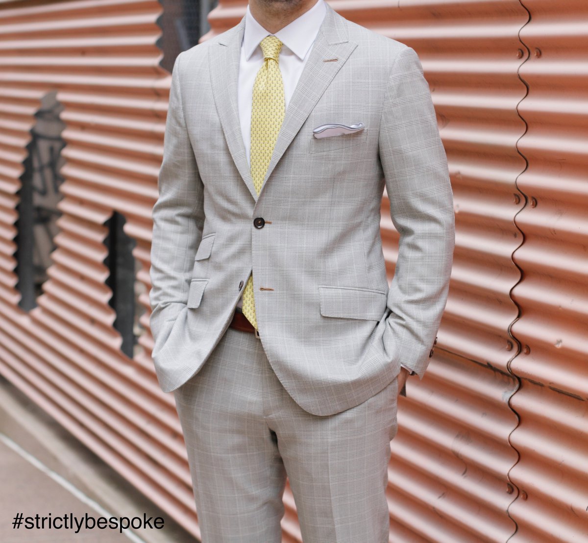 light grey suit with yellow tie