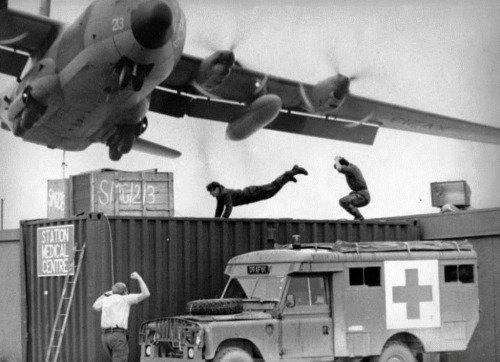 A low flying RAF Hercules over Stanley, Falkland Islands, 1982