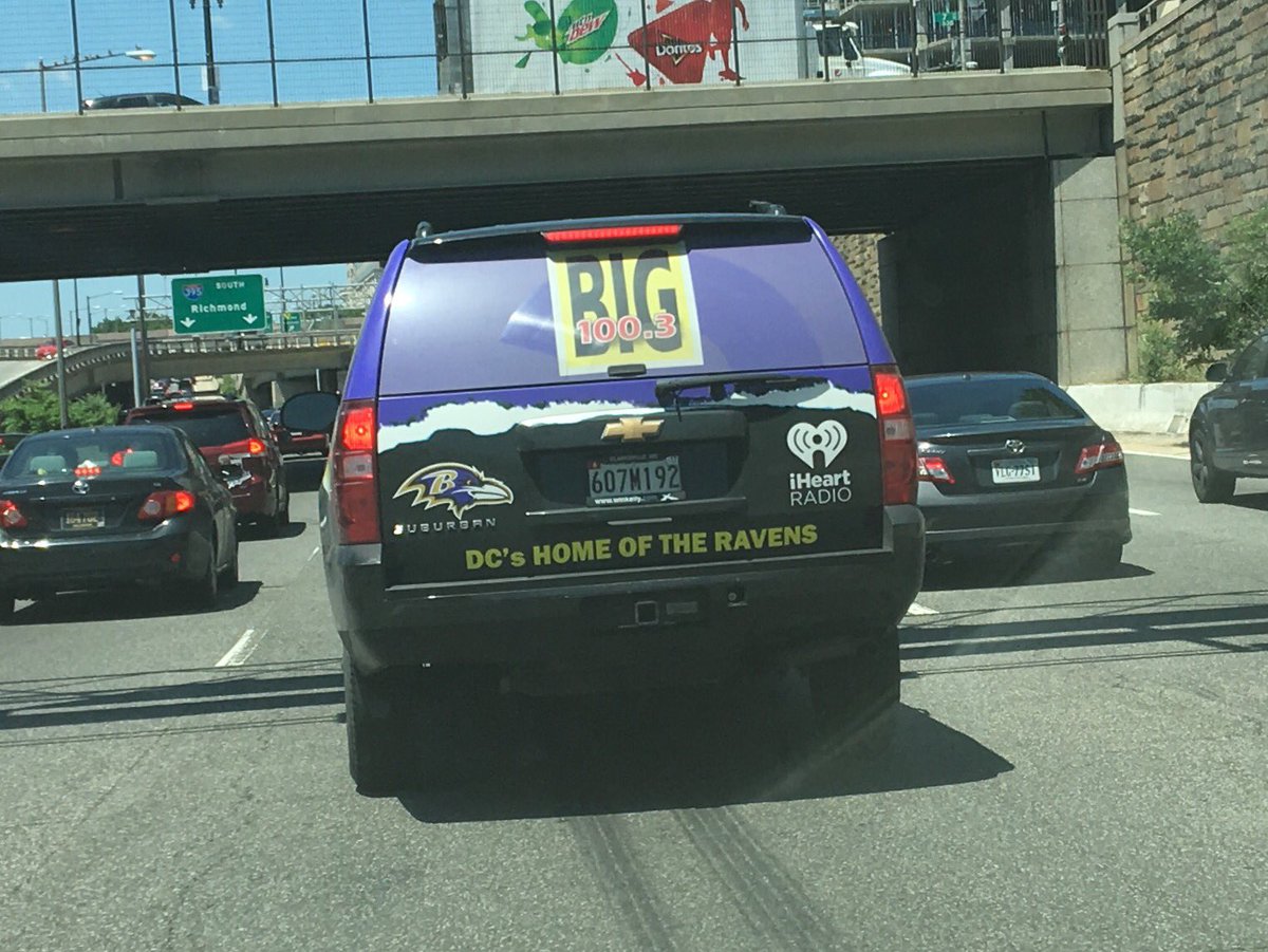 ChrisKinard's tweet photo. Oh, DC's classic rock radio station's promo vehicle is driving through downtown wrapped in the Ravens logo. Does this happen anywhere else? https://t.co/r1GYUfZy5L