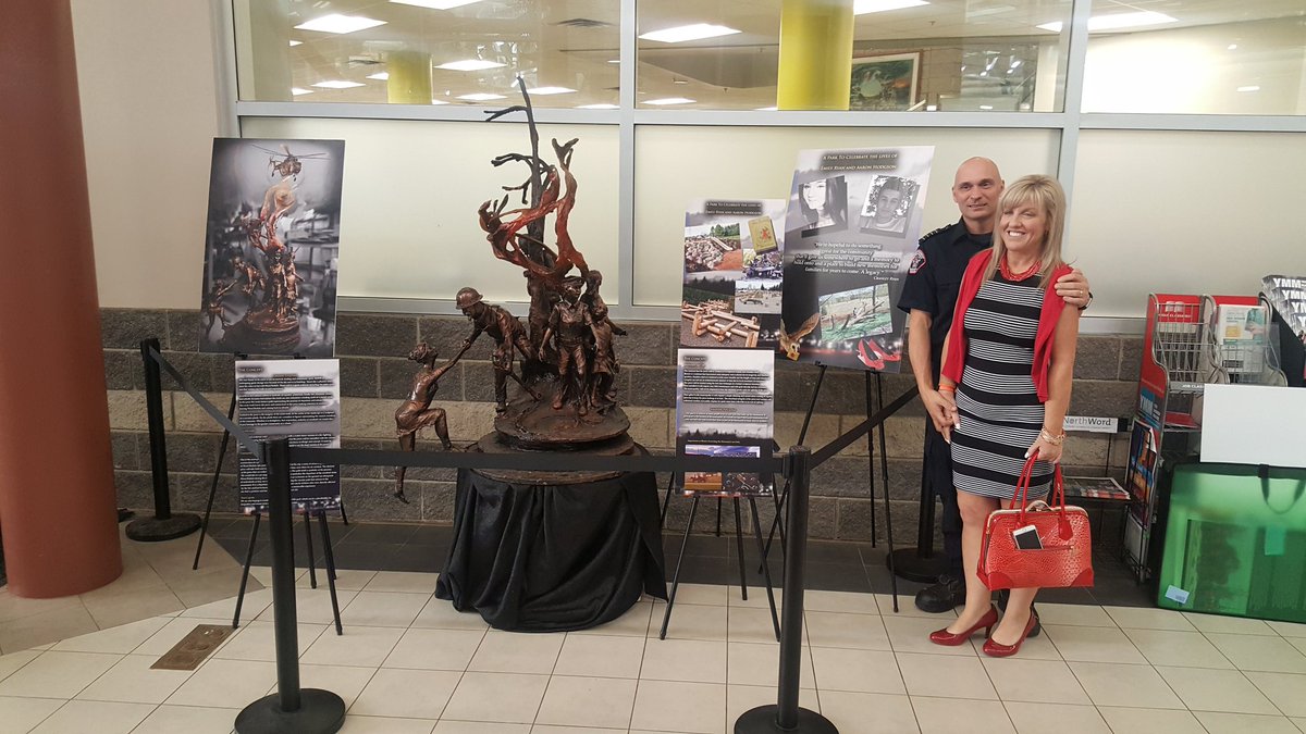 FineArtBronzeNL's tweet photo. Cranley and Melonie Ryan stand next to Ft.Mac sculpture #sapraecreek #woodbuffalo #ftmacstrong #ymm #heart #macisland https://t.co/ZeP3Nq4wE0