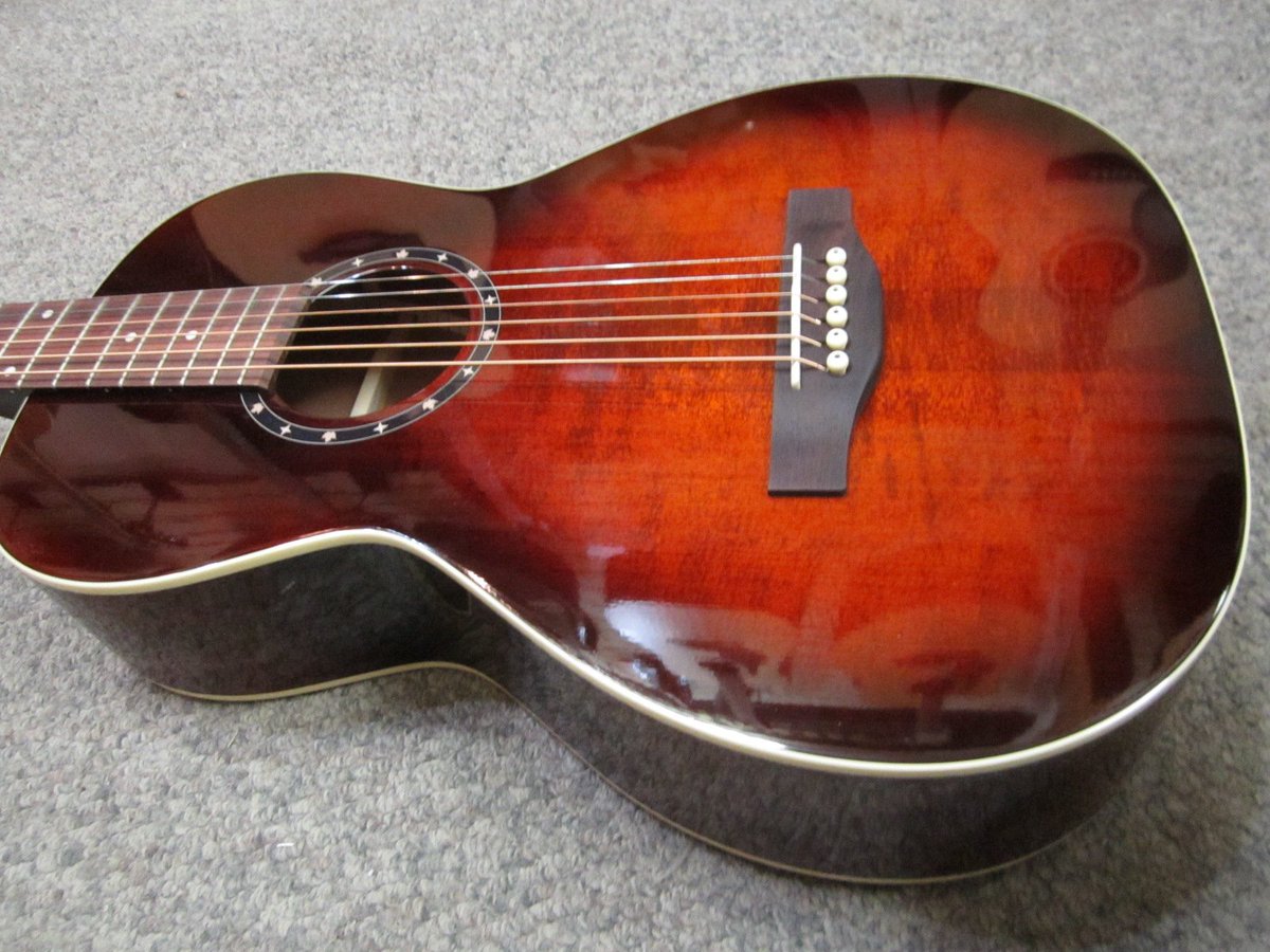 Look at this little beauty! Norman (<a href="/godin_guitars/">Godin Guitars</a> ) ST40 Parlor. Solid cedar top, solid mahogany back/sides. Big tone in a small guitar!