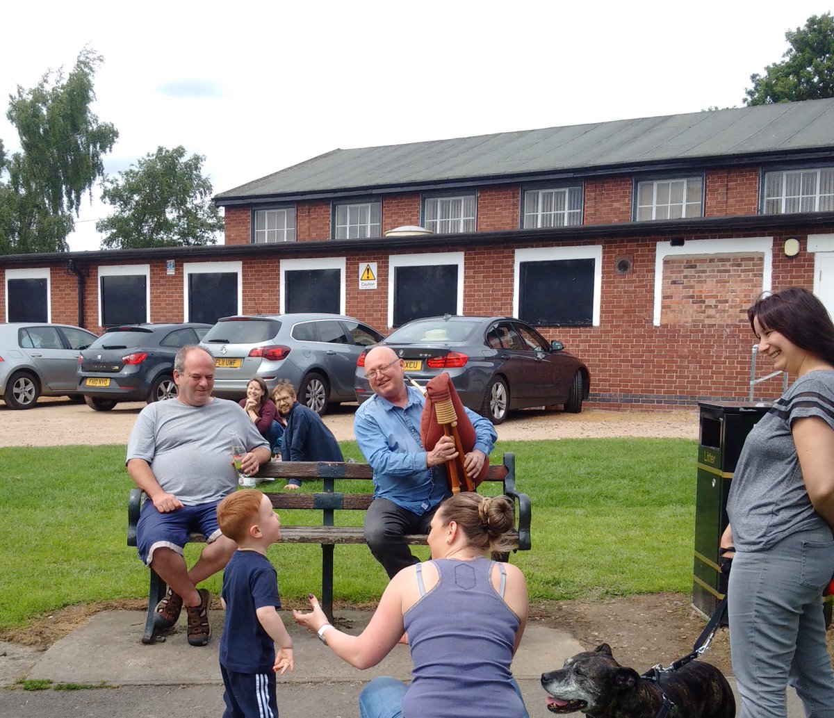 Sharing the #Italian #Zampogna with the next generation at the #Blowout. Man hands on #bagpipe to man...