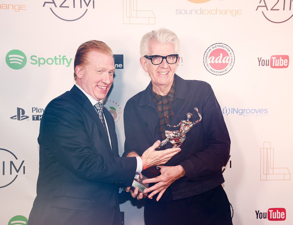 SoundExchange's tweet photo. An honor for our Pres/CEO @MikeHuppe to present #NickLowe w/ the Independent Icon Award at the @a2im Libera Awards! https://t.co/wksMwkeRBu https://t.co/KeBvSenW9Y