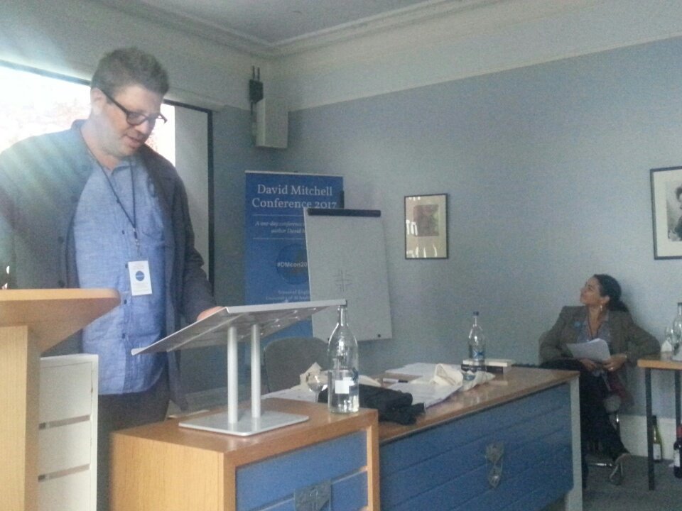 dmcon2017's tweet photo. Now @SlowTimeProf reading his wonderful 'A Perturbation in the Deep Stream' #DMcon2017 https://t.co/dQ4GDNPtlt