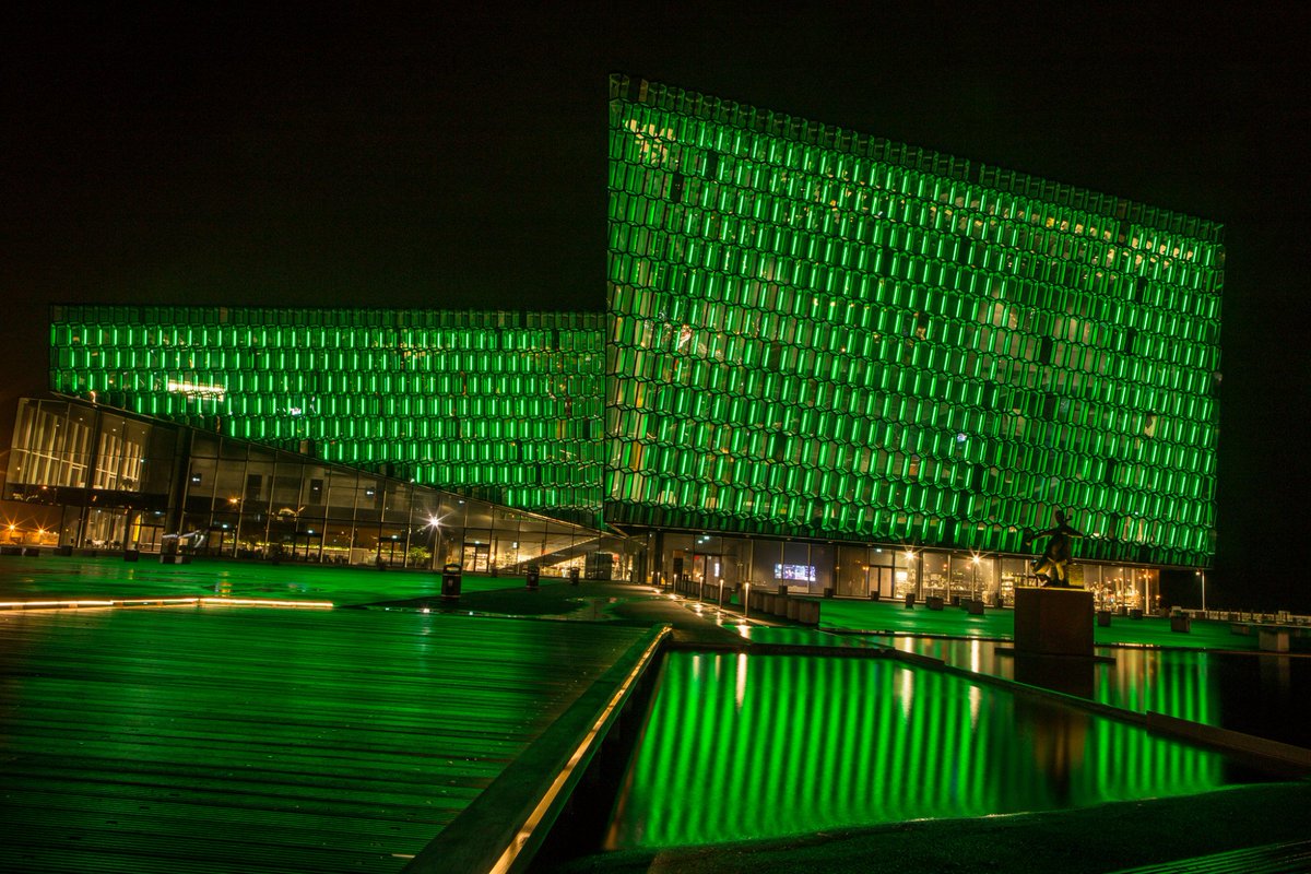 #Harpa in #Reykjavik is lit up in green this weekend in support of the #ParisAgreement