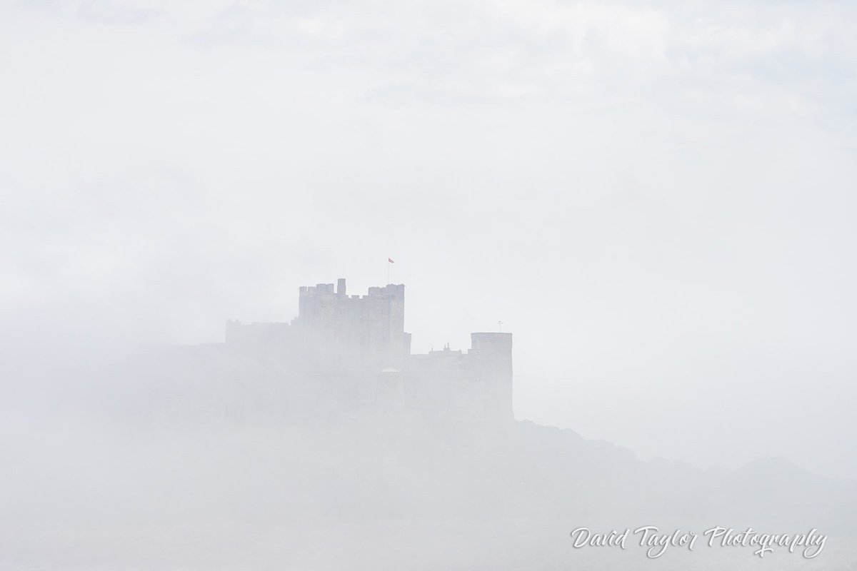 Castle vs. Mist: #Bamburgh Castle emerging from a summer sea fret… #Northumberland