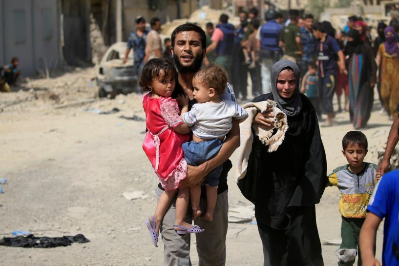 Reuters's tweet photo. Civilians killed while fleeing Islamic State in Mosul https://t.co/nMtRLP3OSu https://t.co/Ec3ifLka6l