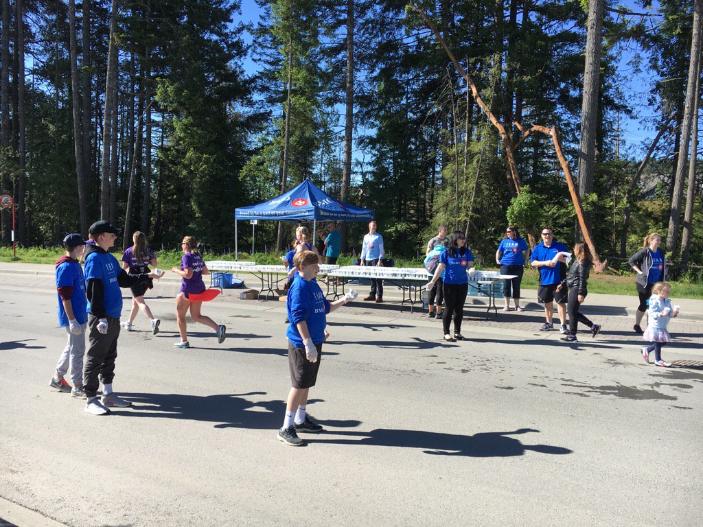 Employees volunteering at the BMO water station at the Victoria Goddess Run!