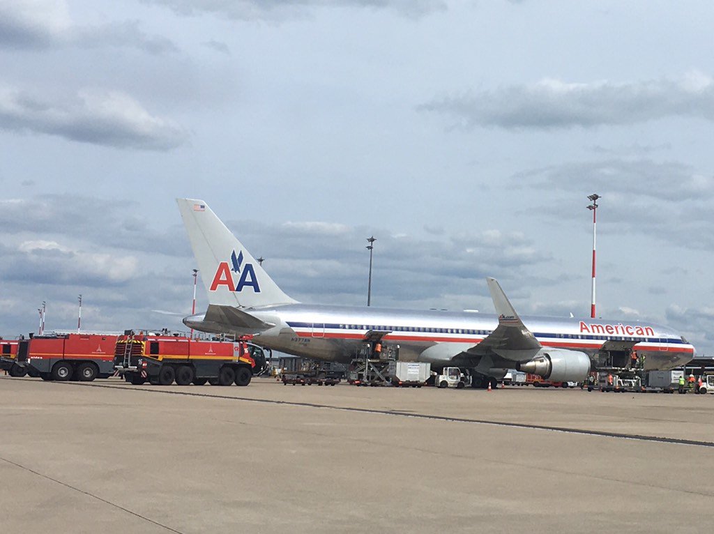 ChandraTurner's tweet photo. @AmericanAir told us flight 65 was cancelled bc sick flight attendant. So why 4 firetrucks and emerg landing at CDG? https://t.co/M8KLZDZuKb