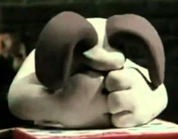 Gromit with his head in his hands.