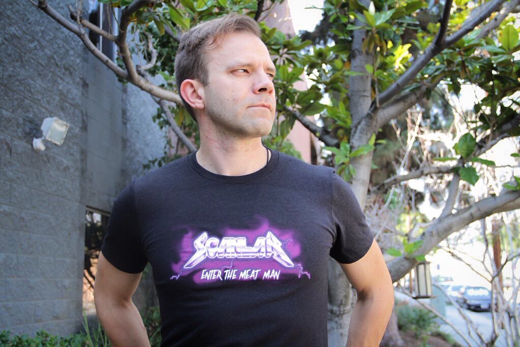 GeekandSundry's tweet photo. Celebrate 100 episodes of @CriticalRole with the official Scanlan Concert T-Shirt! On pre-sale now!https://t.co/OKIEioPFR8 #CriticalRole https://t.co/zmbdHLDryM