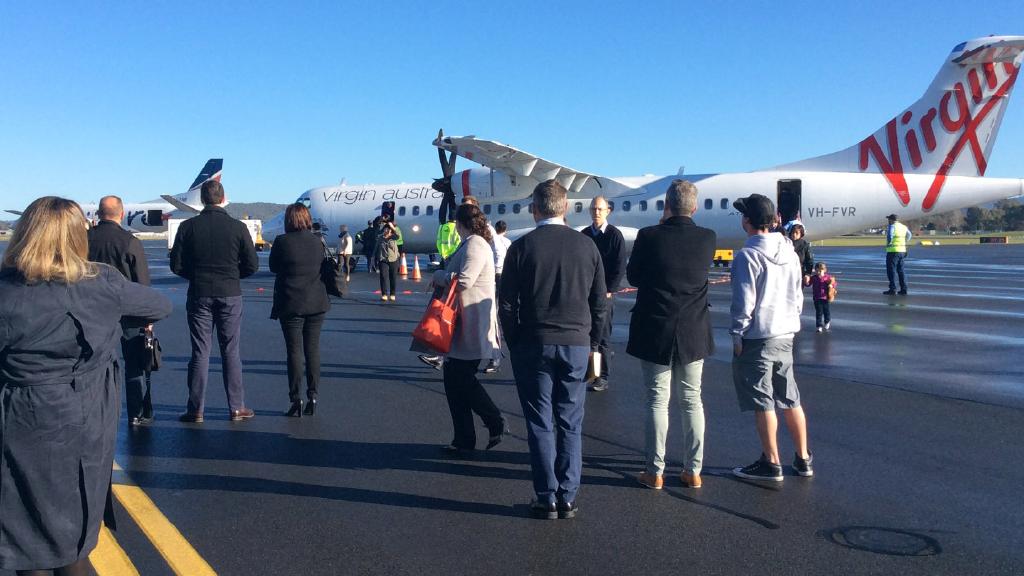 Man arrested over note found in Australian airliner toilet