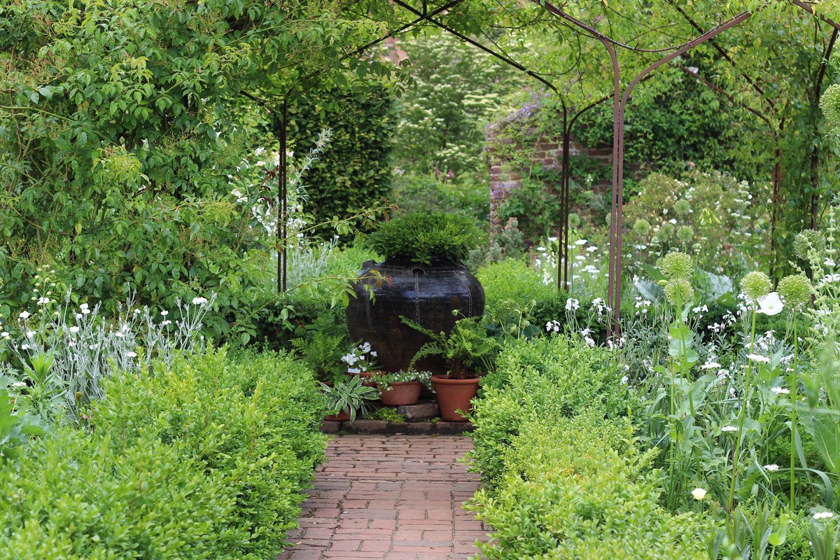 DHgardening's tweet photo. @SissinghurstNT So many! Spectacular explosion of colour in #rosegarden Vibrant green Nuttery &amp; #whitegarden #ferns #lupins #alliums #irisis #SissinghurstNT https://t.co/pM0jSCwaMU