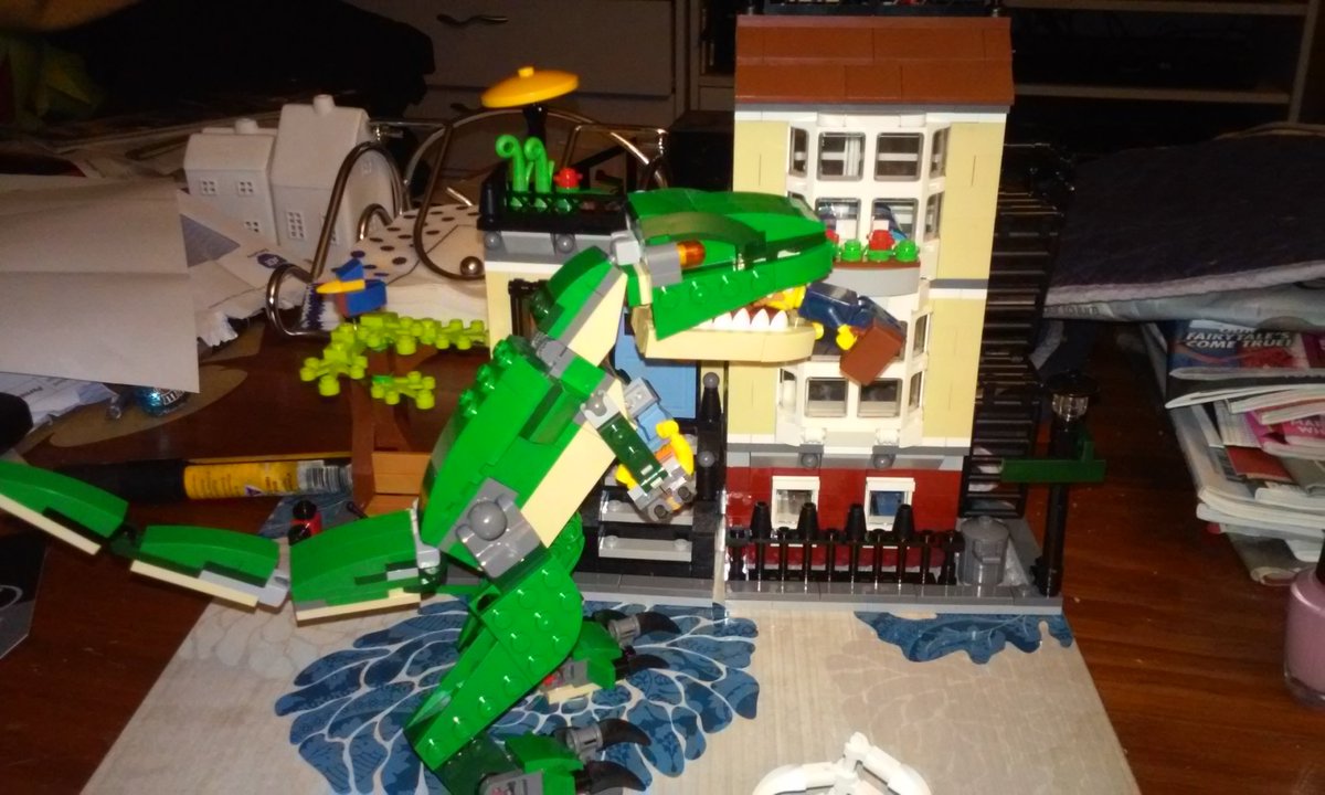 BereccaNZ's tweet photo. The couple who live in my lego townhouse are having a bad day #legoTRex https://t.co/uXXvacMyGN