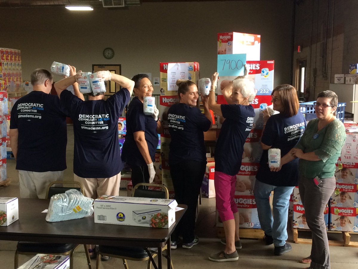 CommunityDems's tweet photo. LD10 #Democrat volunteers celebrate the final count of their first diaper bundling -- just shy of 8000! #CommunityDems #PimaCounty https://t.co/QLitJbaAVu