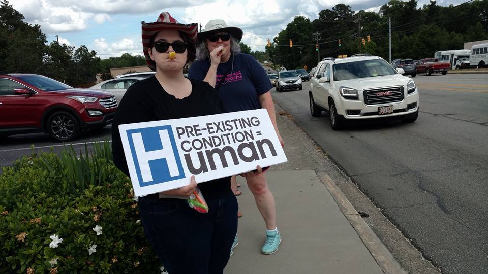 IndivisibleTeam's tweet photo. .@RepJoeWilson ignored constituents to attend $50/person minimum fundraiser, but that didn't stop @IndivisibleSC_2 from protesting outside. https://t.co/GpwVhWhqbI