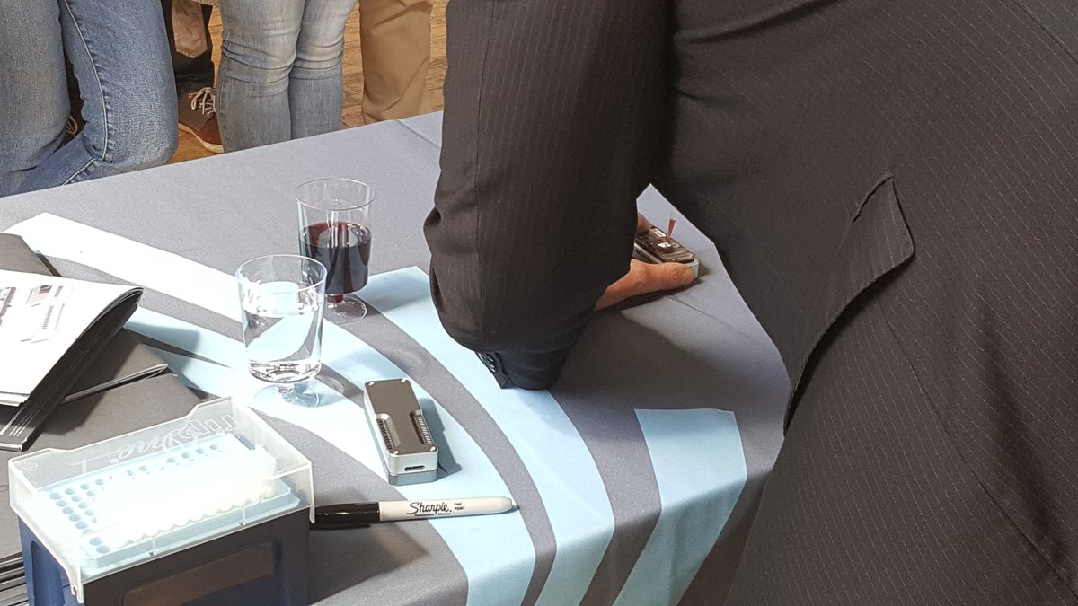 nanopore's tweet photo. You know you're in France when....the loading demo uses red wine to prime the flow cell! https://t.co/Gu265YxRma