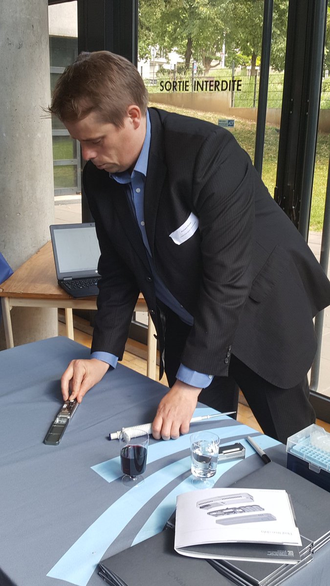 nanopore's tweet photo. You know you're in France when....the loading demo uses red wine to prime the flow cell! https://t.co/Gu265YxRma