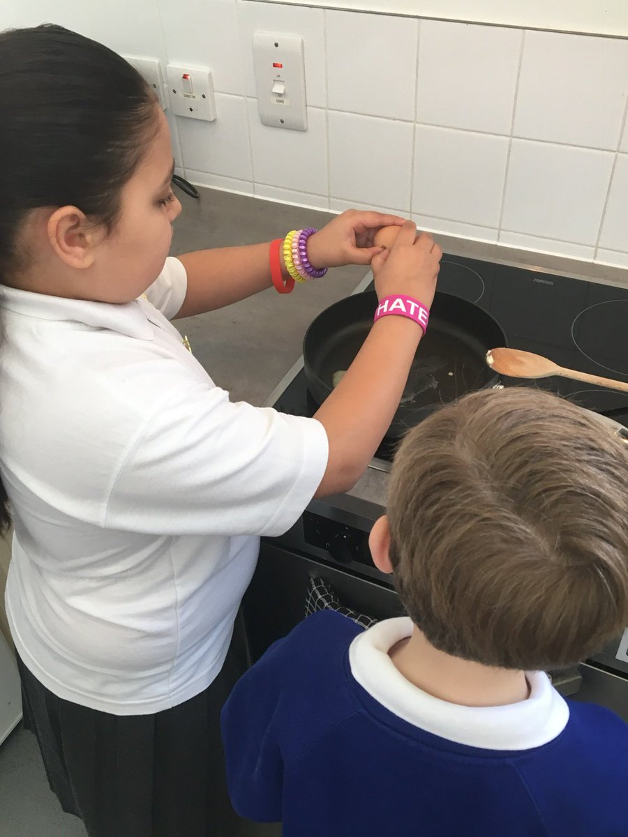 Learners cook fresh eggs at Courtyard. Yum