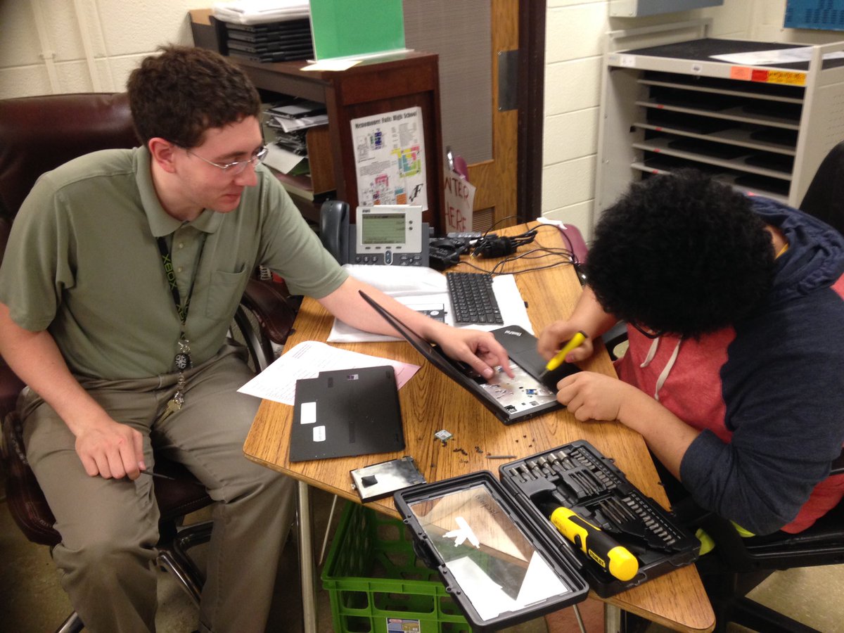 fallstechforce's tweet photo. Experienced tech, Mr. J, showing Than, a rookie, how to fix a damaged laptop casing #finalexams #fallspride https://t.co/CinOp4CR3c