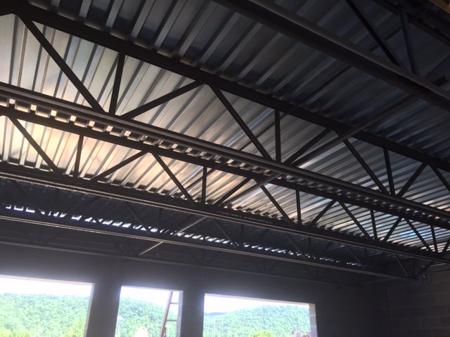 First layer of Roofing is done!  Every day we are closer to completion! #GoMustangs