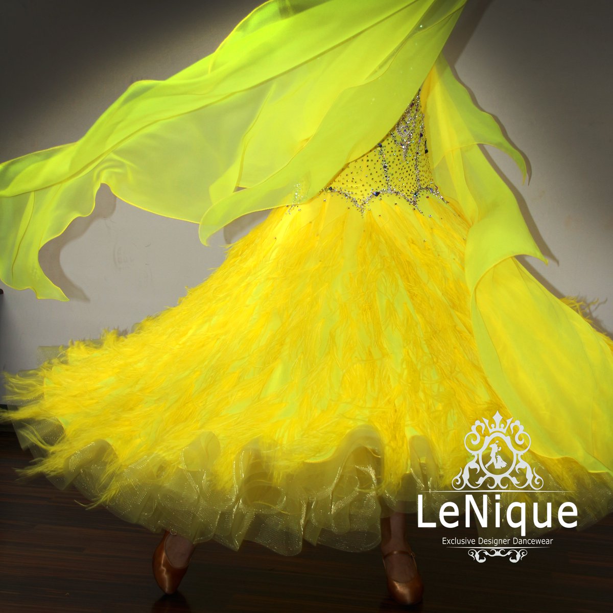 LeNiqueLA's tweet photo. When you put on a #LeNique #dress and you can't help but #twirl! 😁 #dance #ballroom #smooth #yellowdress #feathers #dancewear #rhinestones https://t.co/wNI5TrPEor